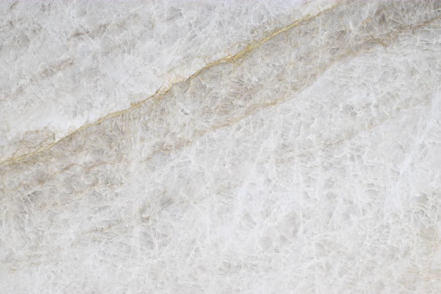 Tajmahal — close view of the stone surface. Warm ivory carrying a broad golden seam.